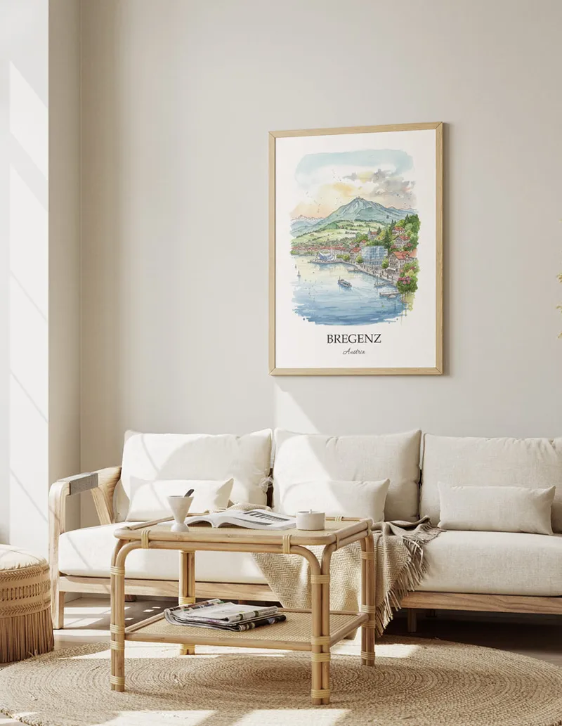 Framed wall art featuring Bregenz, Austria in a light wood frame hanging above a sofa in a modern living room.