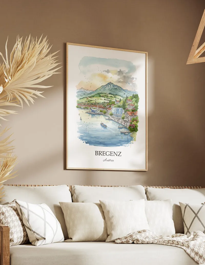 Vintage travel poster of Bregenz city, Austria in a light frame displayed above a sofa in a bright boho interior.