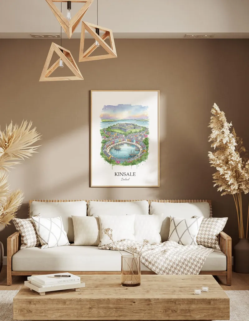 A gorgeous boho-inspired living space with a framed vintage travel poster of Kinsale city on display.