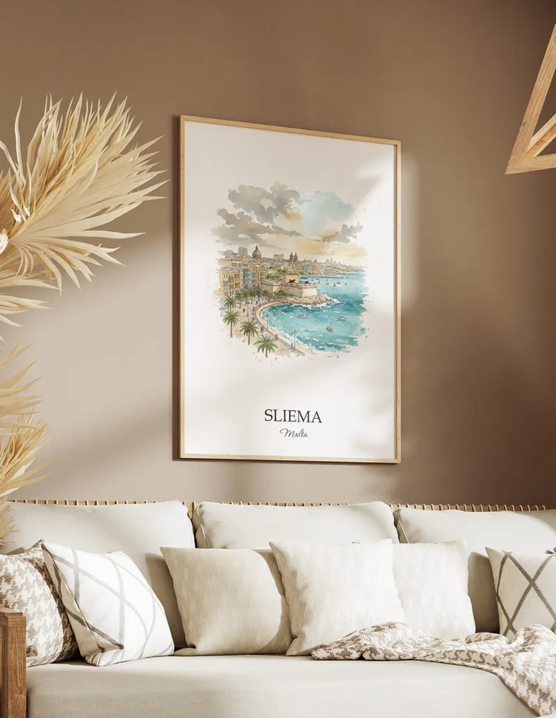 Vintage travel poster of Sliema city, Malta in a light frame displayed above a sofa in a bright boho interior.