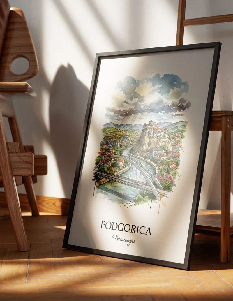 Minimalist poster of Podgorica city in Montenegro in a light frame standing on the floor in a dark moody interior.