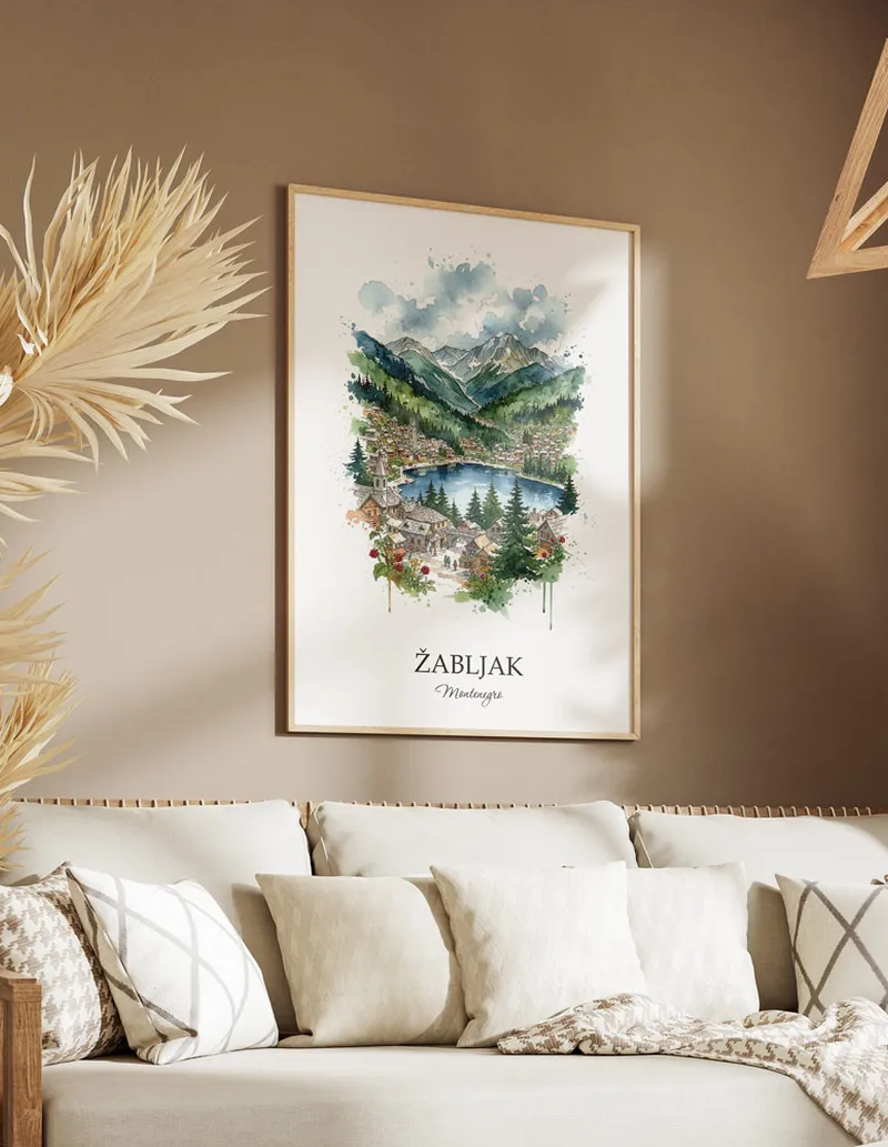 Vintage travel poster of _abljak city, Montenegro in a light frame displayed above a sofa in a bright boho interior.
