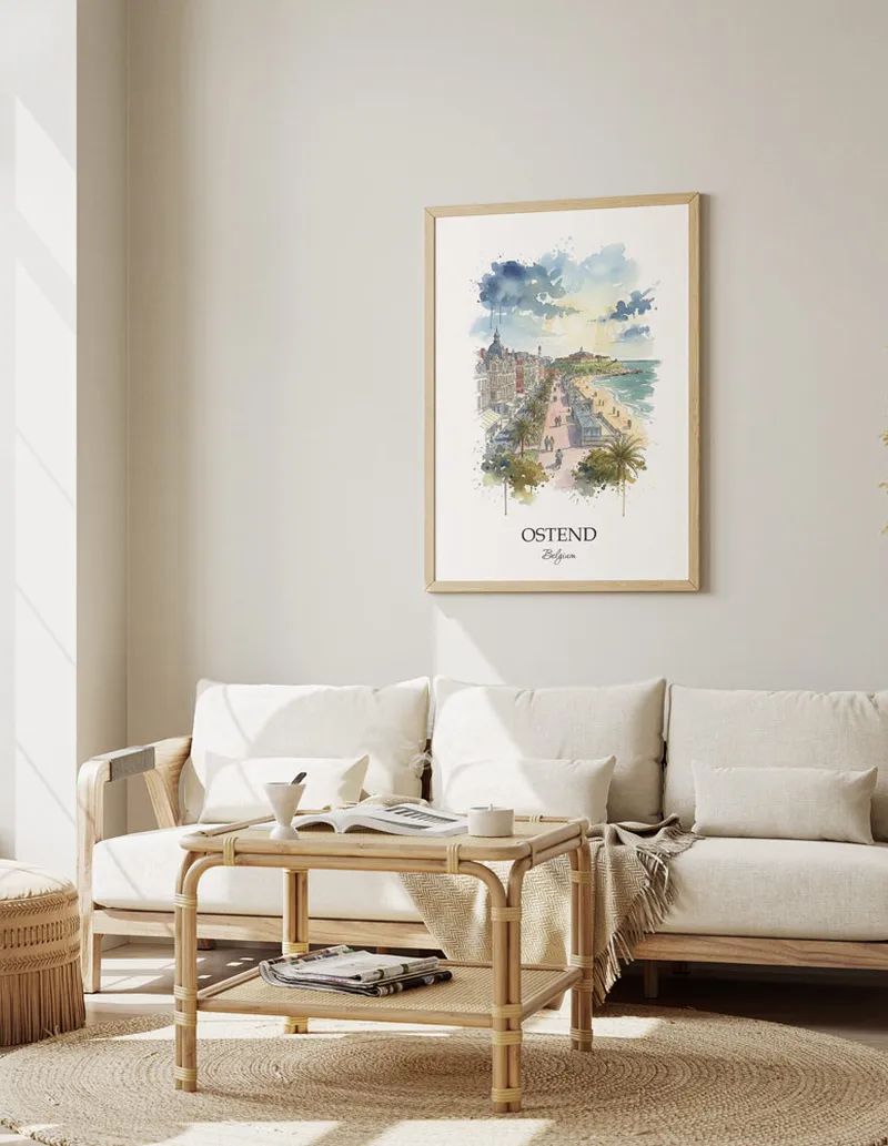 Framed wall art featuring Ostend, Belgium in a light wood frame hanging above a sofa in a modern living room.