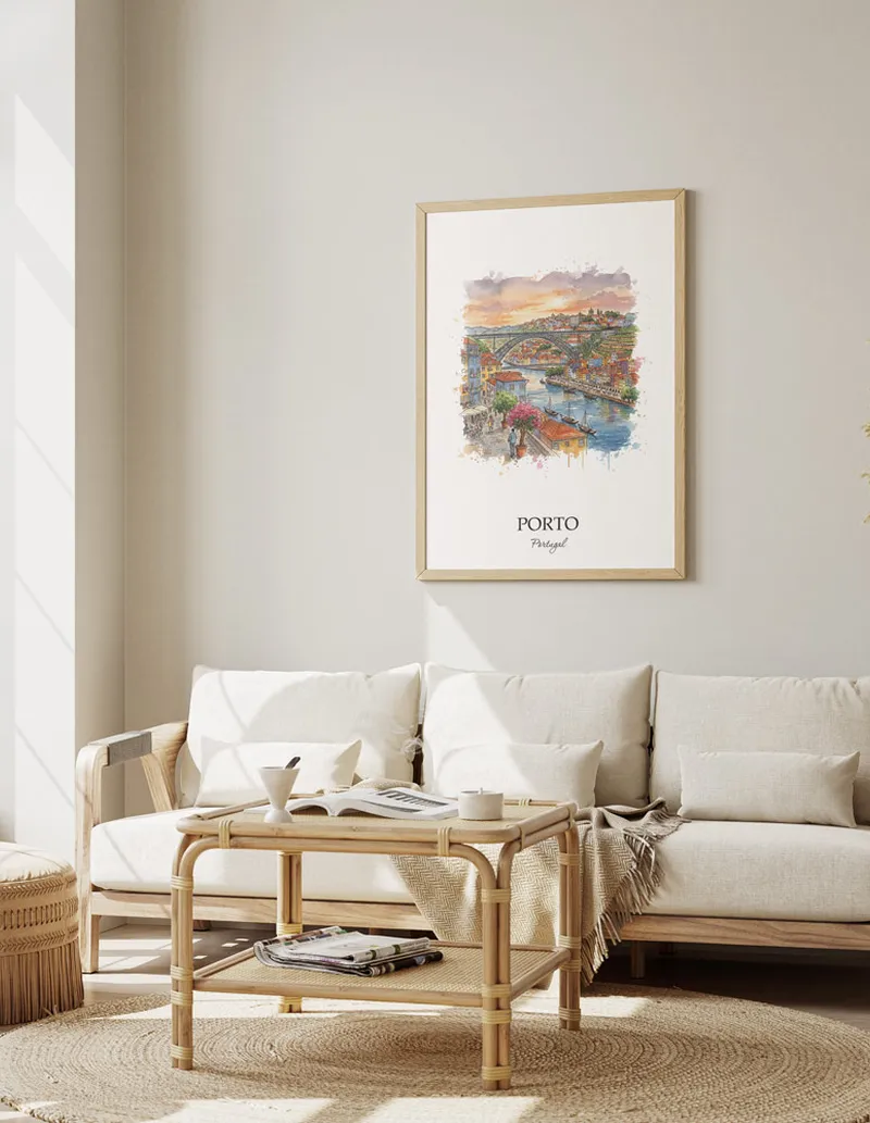 Framed wall art featuring Porto, Portugal in a light wood frame hanging above a sofa in a modern living room.