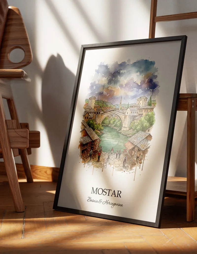 Minimalist poster of Mostar city in Bosnia & Herzegovina in a light frame standing on the floor in a dark moody interior.