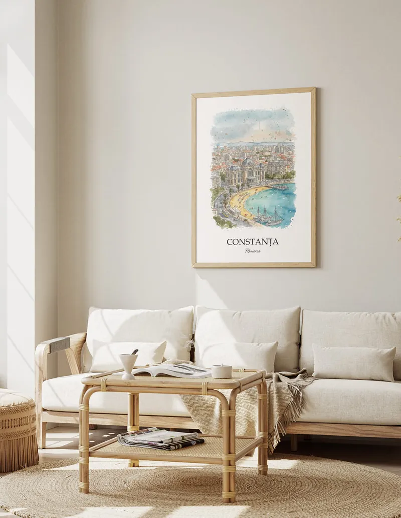 Framed wall art featuring Constan_a, Romania in a light wood frame hanging above a sofa in a modern living room.