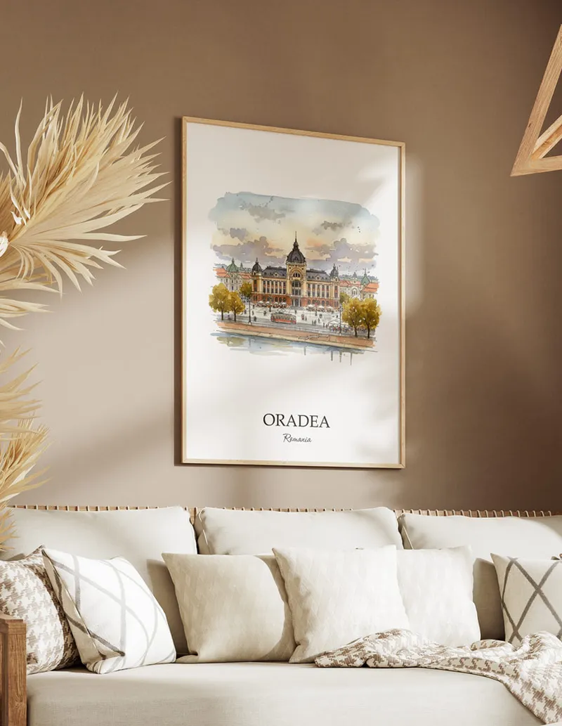 Vintage travel poster of Oradea city, Romania in a light frame displayed above a sofa in a bright boho interior.