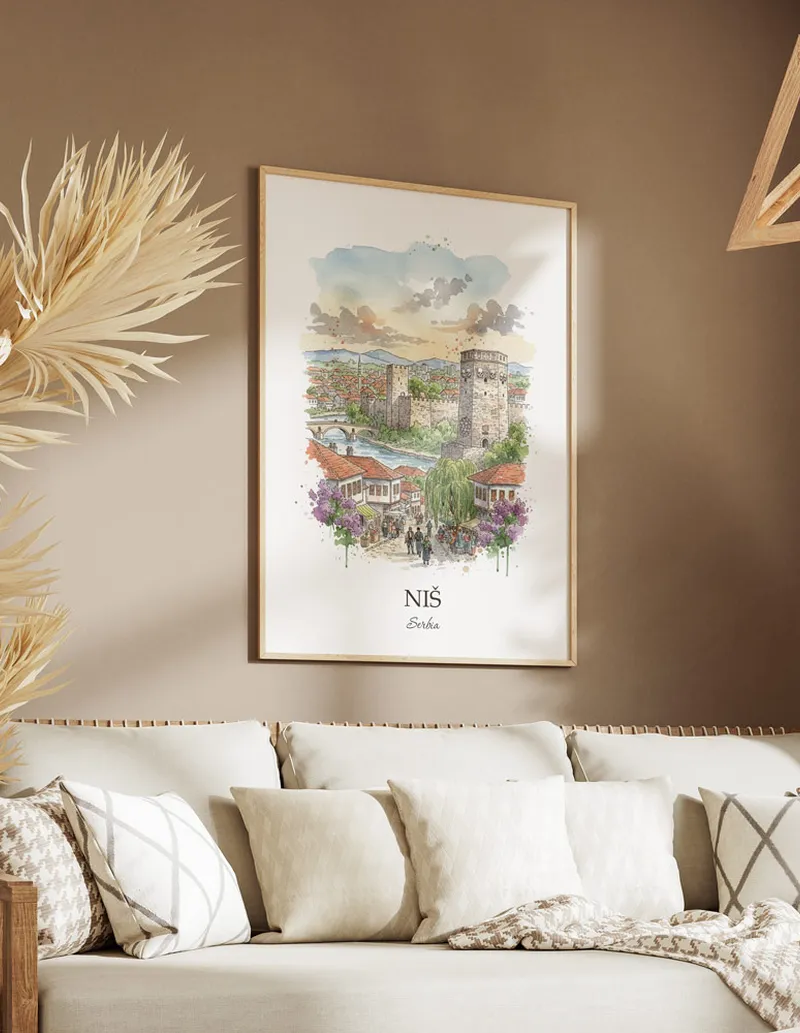 Vintage travel poster of Ni_ city, Serbia in a light frame displayed above a sofa in a bright boho interior.
