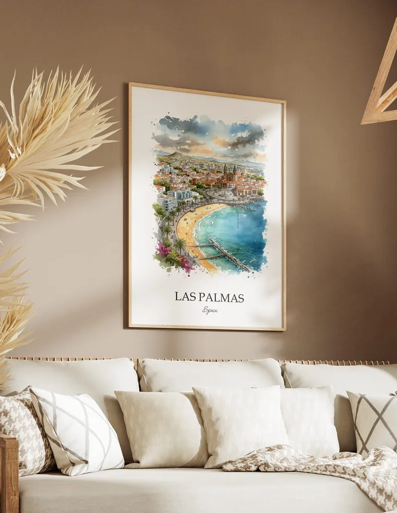 Vintage travel poster of Las Palmas (Gran Canaria) city, Spain in a light frame displayed above a sofa in a bright boho interior.