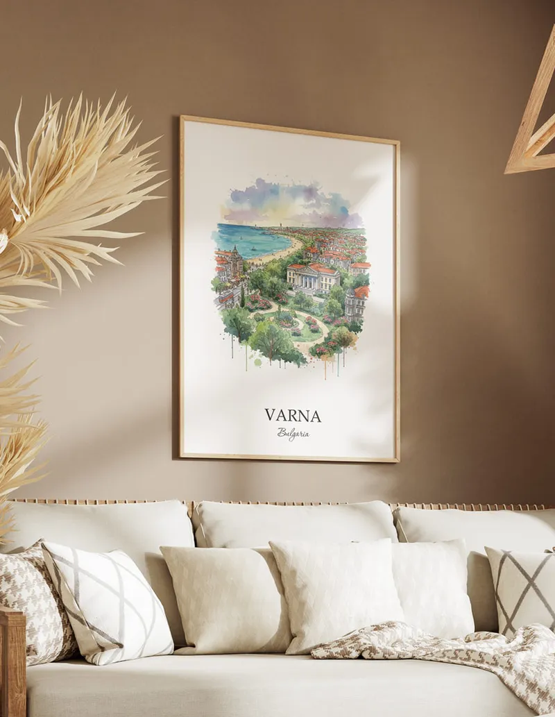 Vintage travel poster of Varna city, Bulgaria in a light frame displayed above a sofa in a bright boho interior.