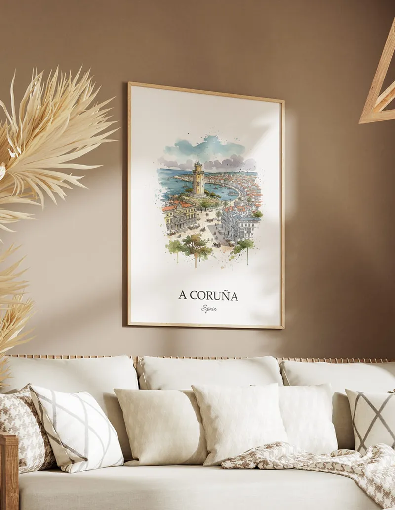 Vintage travel poster of A Coruña city, Spain in a light frame displayed above a sofa in a bright boho interior.