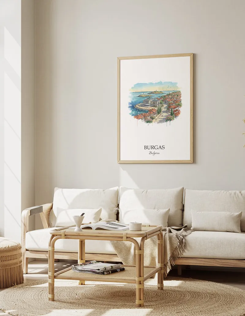 Framed wall art featuring Burgas, Bulgaria in a light wood frame hanging above a sofa in a modern living room.