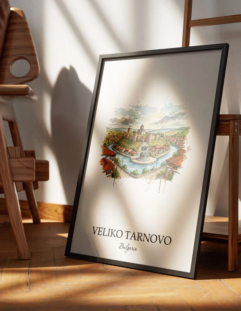 Minimalist poster of Veliko Tarnovo city in Bulgaria in a light frame standing on the floor in a dark moody interior.