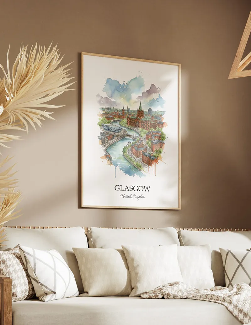 Vintage travel poster of Glasgow city, United Kingdom in a light frame displayed above a sofa in a bright boho interior.