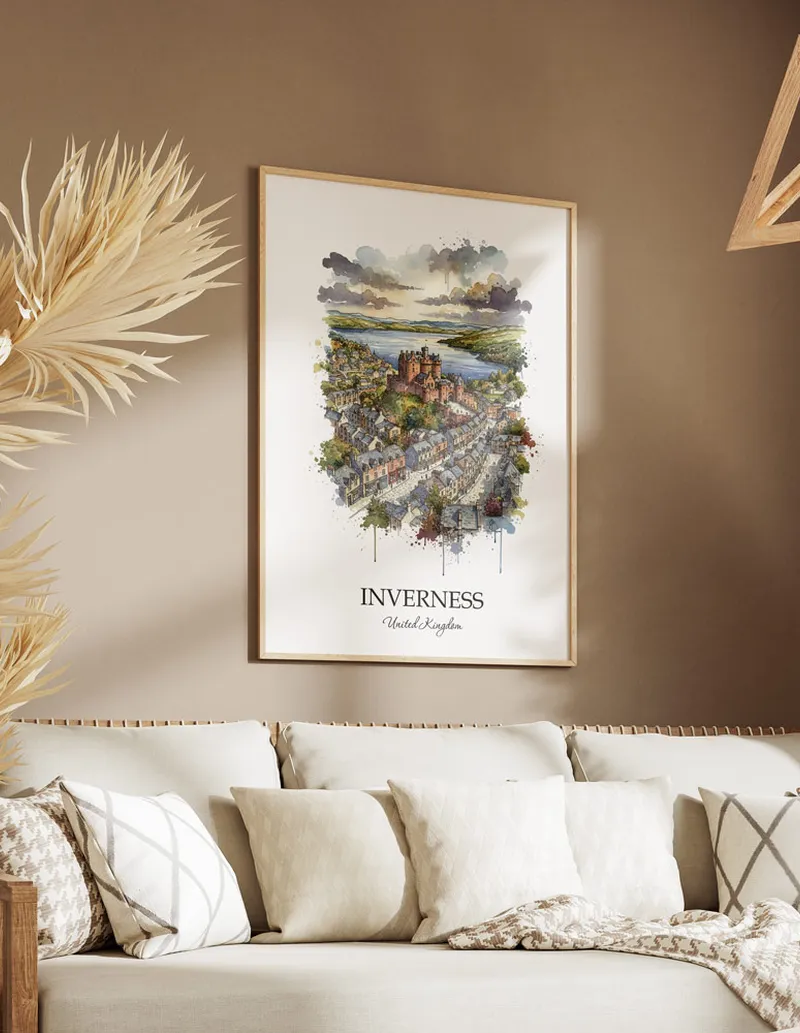 Vintage travel poster of Inverness city, United Kingdom in a light frame displayed above a sofa in a bright boho interior.