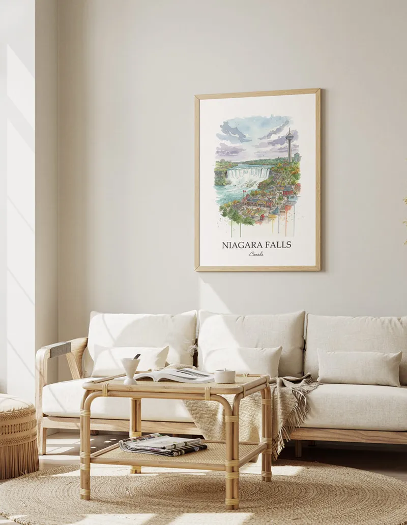 Framed wall art featuring Niagara Falls, Canada in a light wood frame hanging above a sofa in a modern living room.
