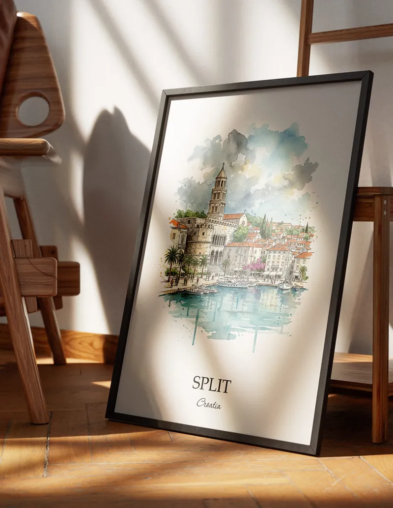 Minimalist poster of Split city in Croatia in a light frame standing on the floor in a dark moody interior.