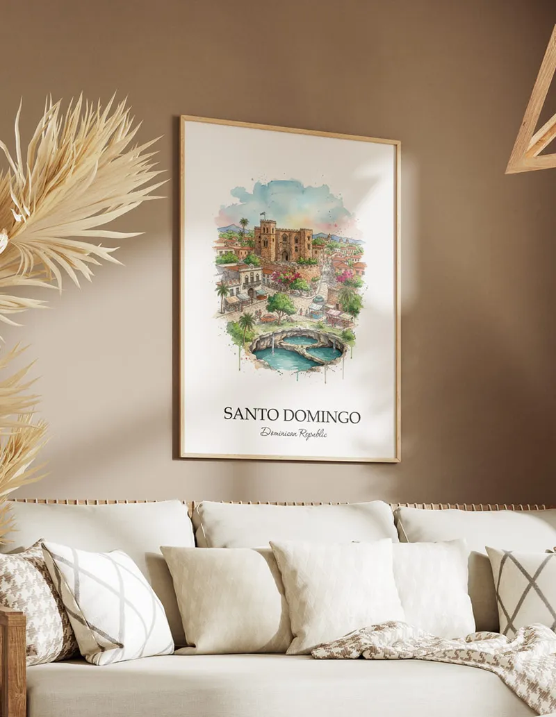 Vintage travel poster of Santo Domingo city, Dominican Republic in a light frame displayed above a sofa in a bright boho interior.