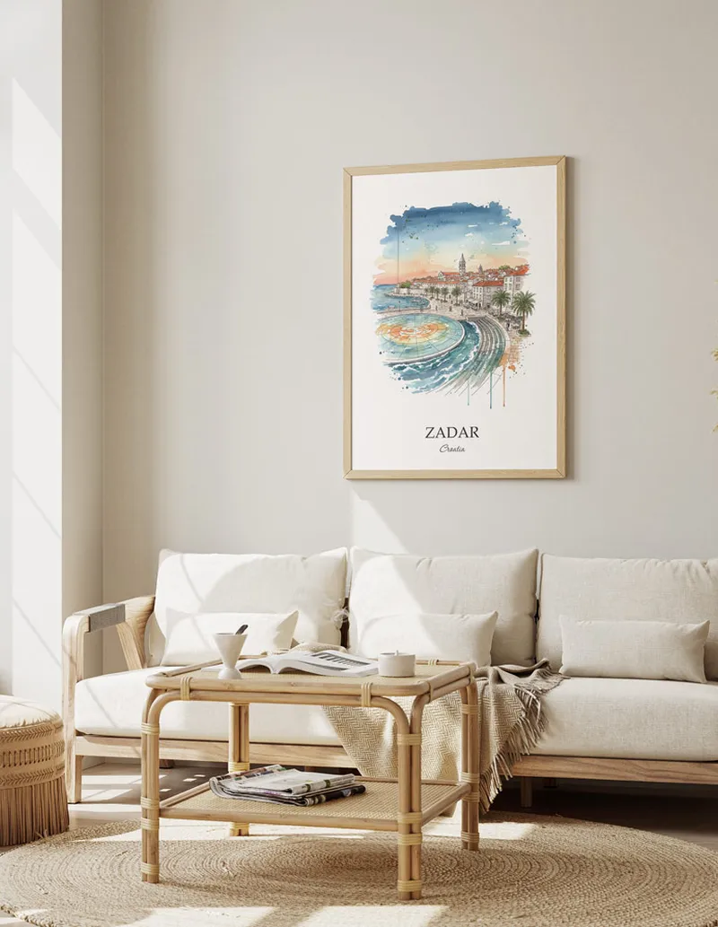 Framed wall art featuring Zadar, Croatia in a light wood frame hanging above a sofa in a modern living room.