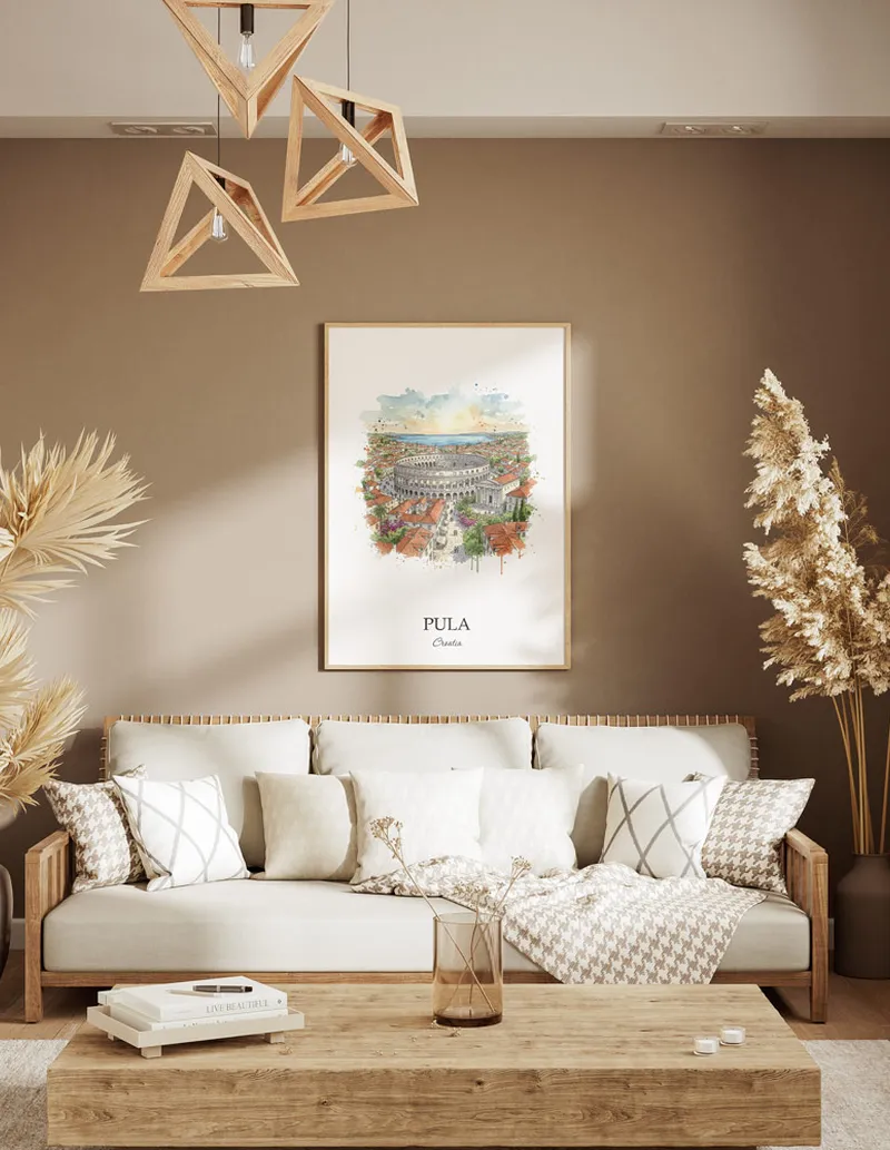 A gorgeous boho-inspired living space with a framed vintage travel poster of Pula city on display.