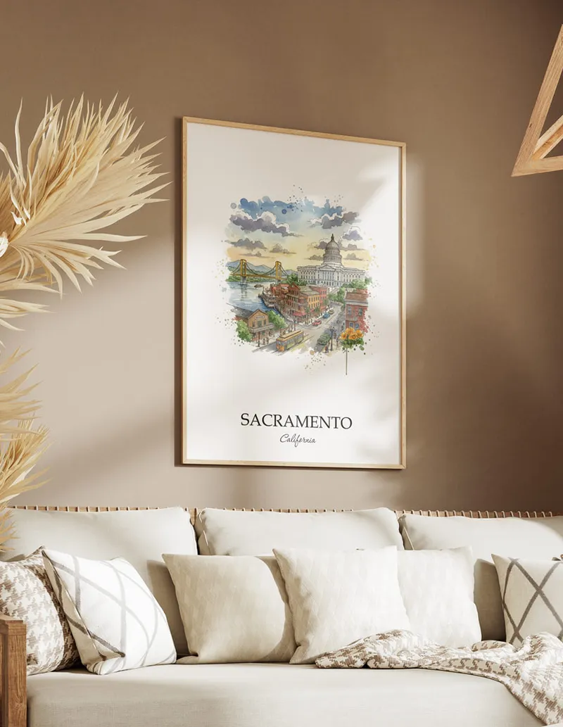 Vintage travel poster of Sacramento city, USA - California in a light frame displayed above a sofa in a bright boho interior.