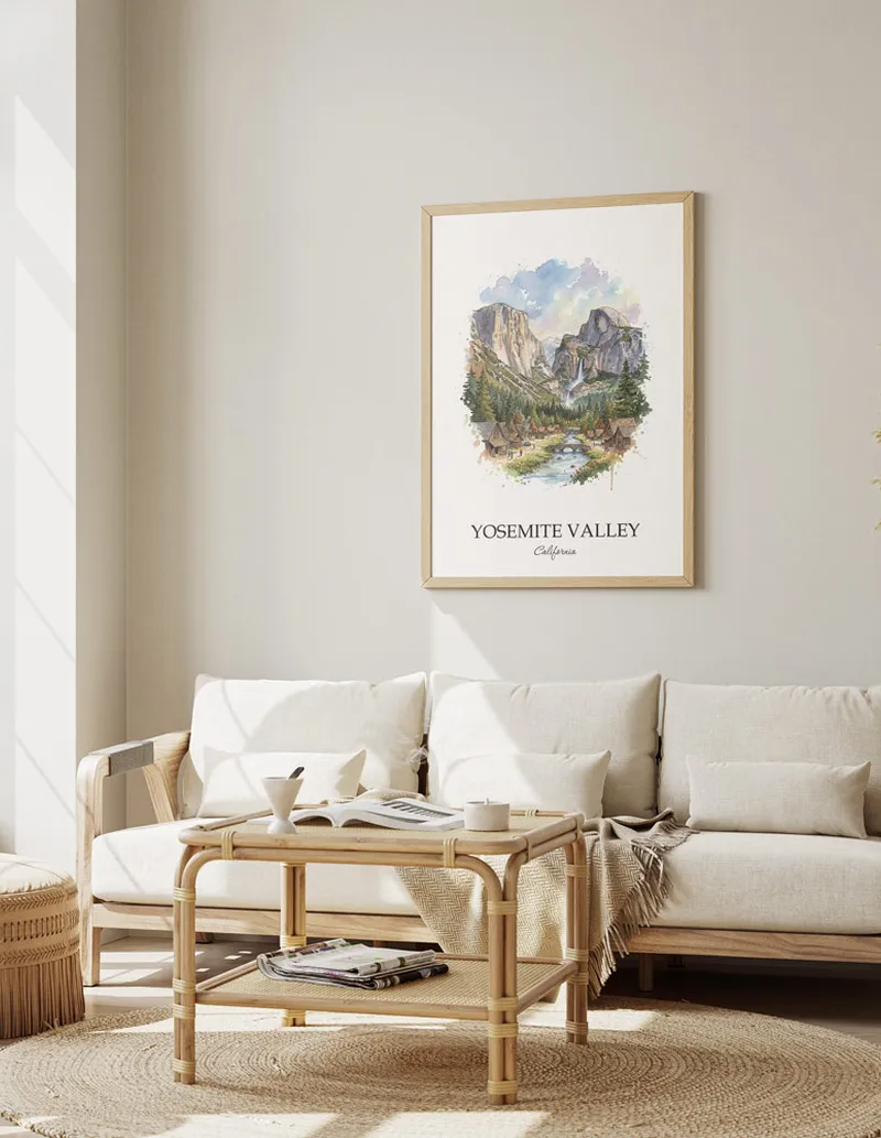 Framed wall art featuring Yosemite Valley, USA - California in a light wood frame hanging above a sofa in a modern living room.