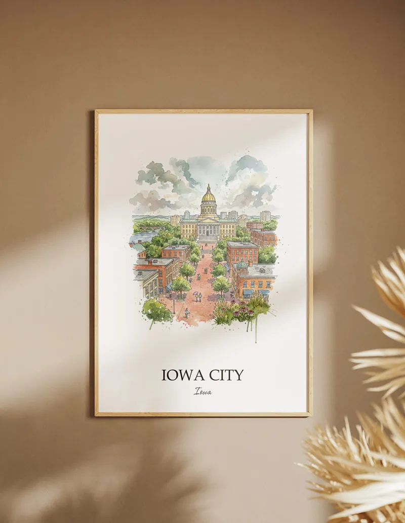 A clean and modern mockup showing a framed Iowa City city print on a minimalist background.
