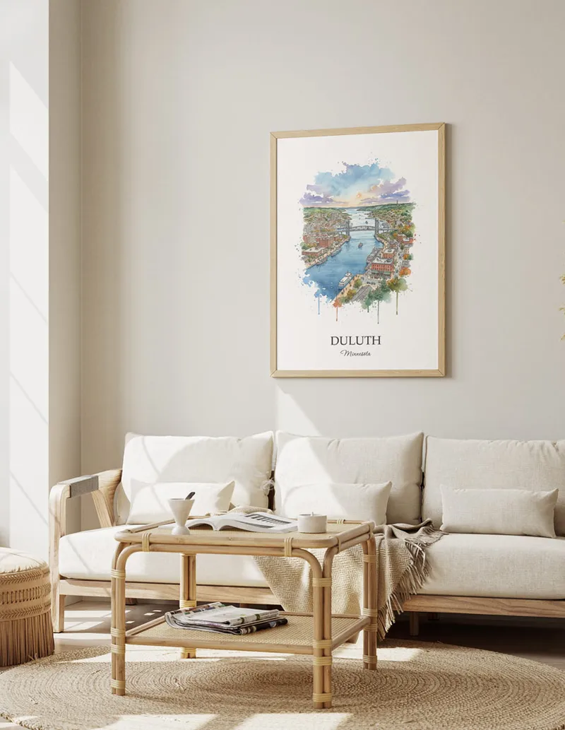 Framed wall art featuring Duluth, USA - Minnesota in a light wood frame hanging above a sofa in a modern living room.