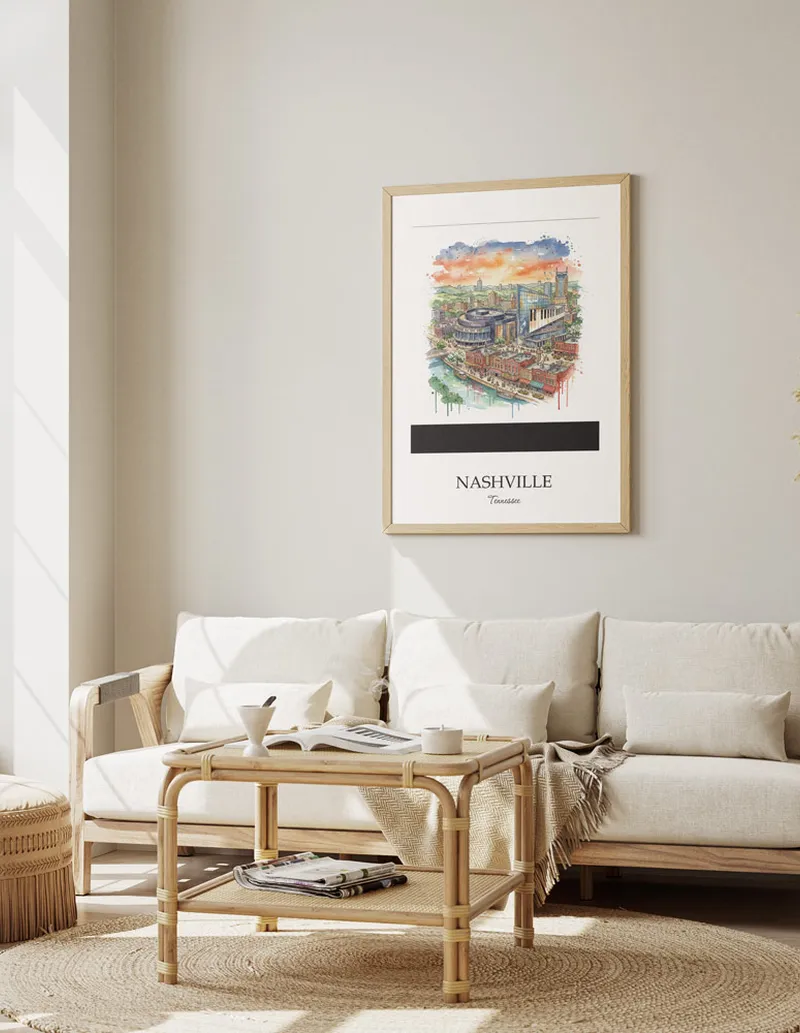Framed wall art featuring Nashville, USA - Tennessee in a light wood frame hanging above a sofa in a modern living room.