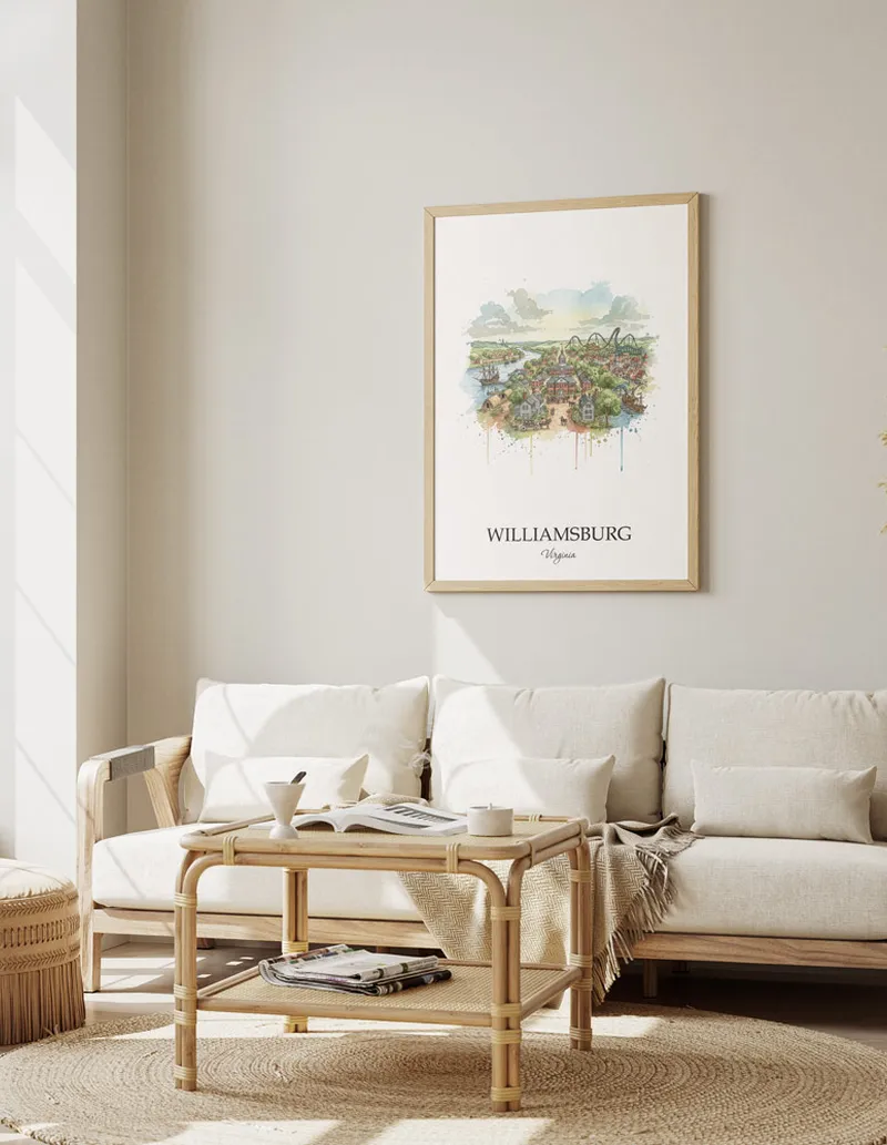Framed wall art featuring Williamsburg, USA - Virginia in a light wood frame hanging above a sofa in a modern living room.