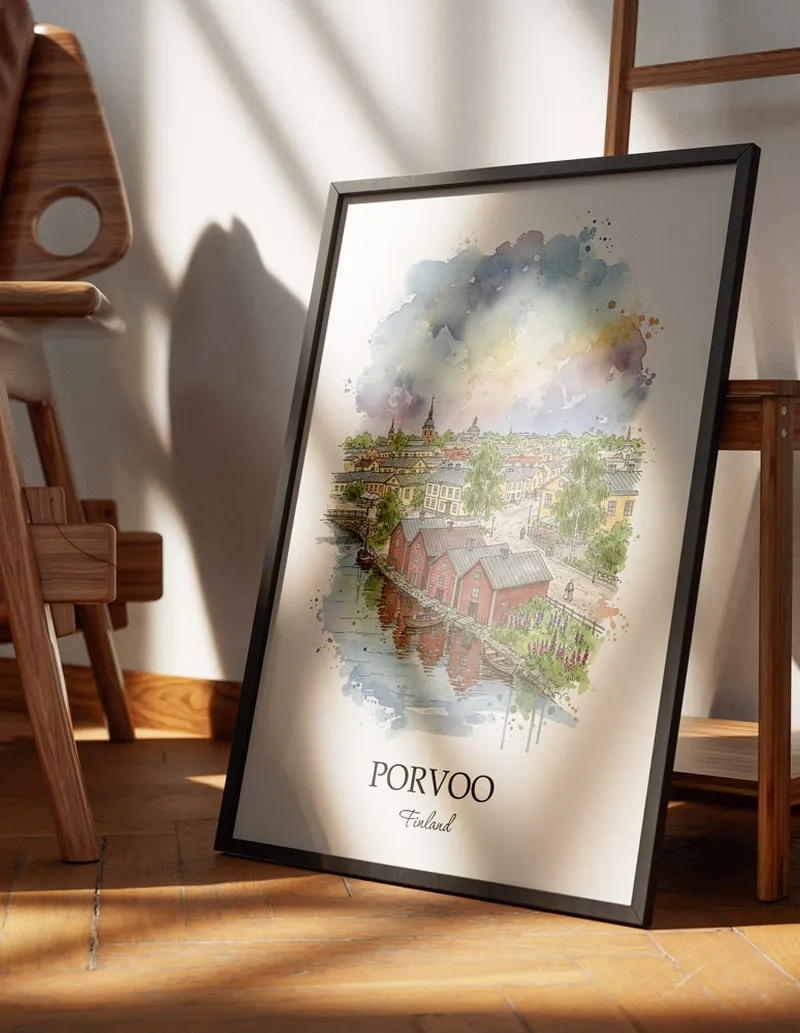 Minimalist poster of Porvoo city in Finland in a light frame standing on the floor in a dark moody interior.
