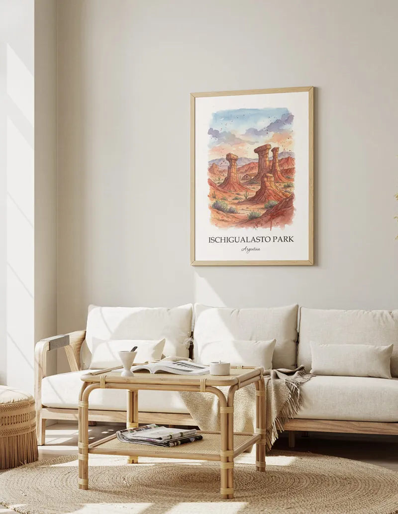 Framed wall art featuring Ischigualasto Park, Argentina in a light wood frame hanging above a sofa in a modern living room.
