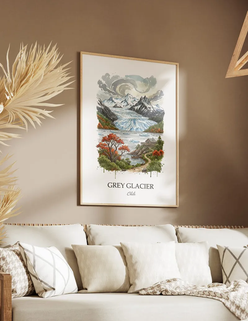 Vintage travel poster of Grey Glacier, Chile in a light frame displayed above a sofa in a bright boho interior.