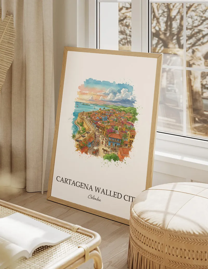 Framed wall art featuring Cartagena Walled City, Colombia in a light wood frame hanging above a sofa in a modern living room.
