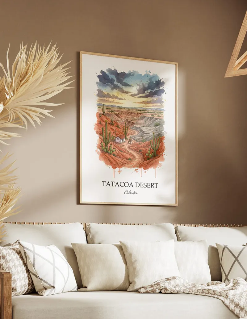 A gorgeous boho-inspired living space with a framed vintage travel poster of Tatacoa Desert in Colombia on display.