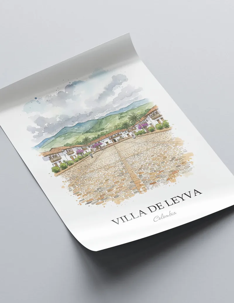 Framed wall art featuring Villa de Leyva in Colombia in a light wood frame leaning on the floor.