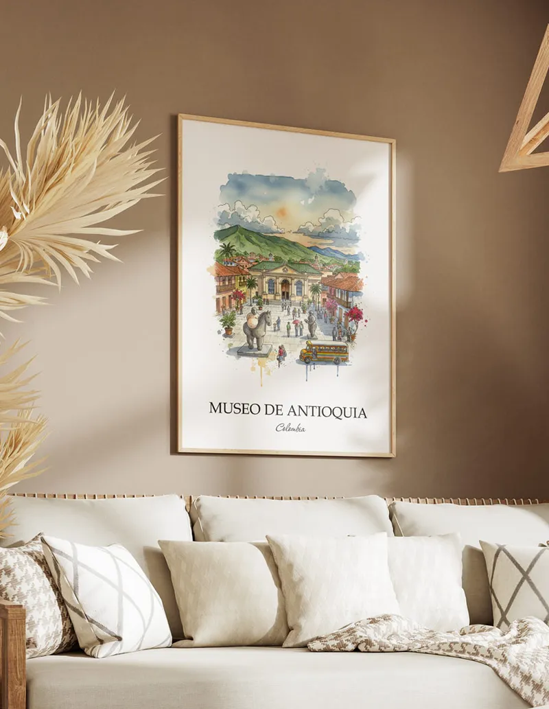 A gorgeous boho-inspired living space with a framed vintage travel poster of Museo de Antioquia in Colombia on display.