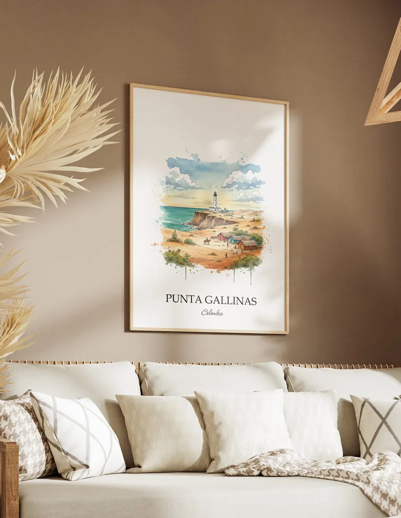 A gorgeous boho-inspired living space with a framed vintage travel poster of Punta Gallinas in Colombia on display.