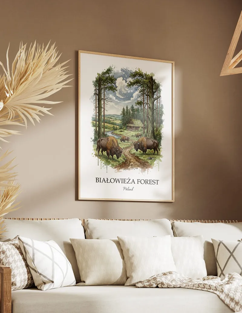 Framed wall art featuring Bia_owie_a Forest, Poland in a light wood frame hanging above a sofa in a modern living room.