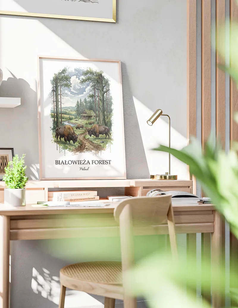 A gorgeous boho-inspired living space with a framed vintage travel poster of Bia_owie_a Forest in Poland on display.