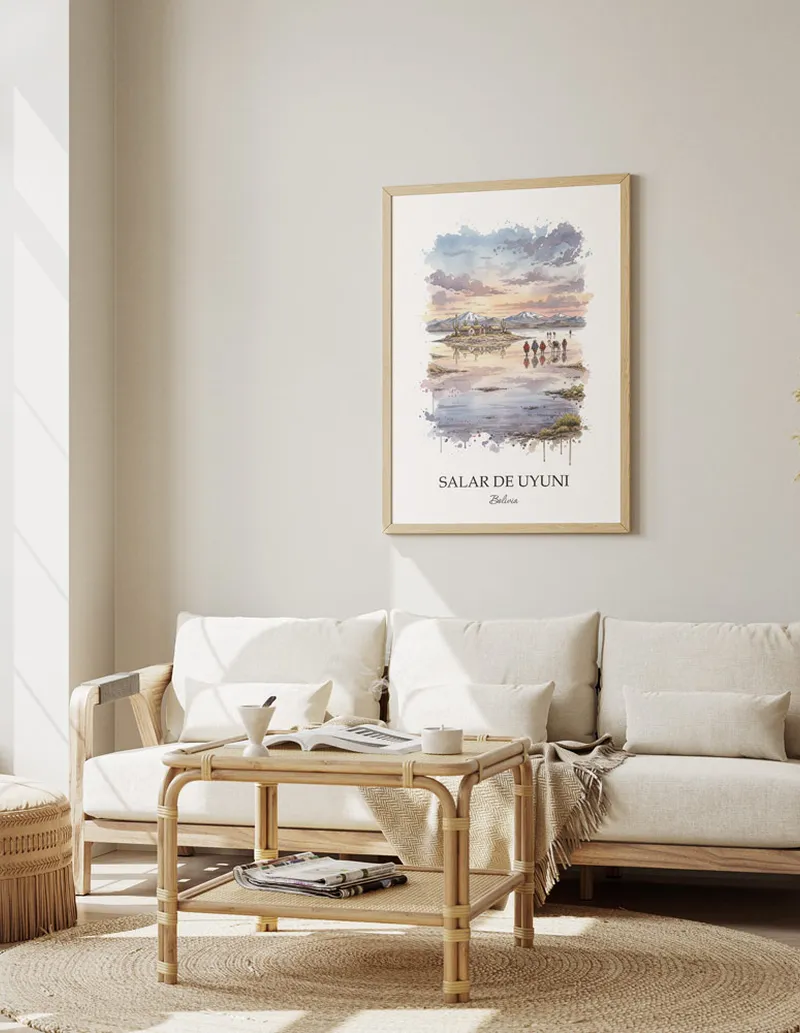 Vintage travel poster of Salar de Uyuni, Bolivia in a light frame displayed above a sofa in a bright boho interior.