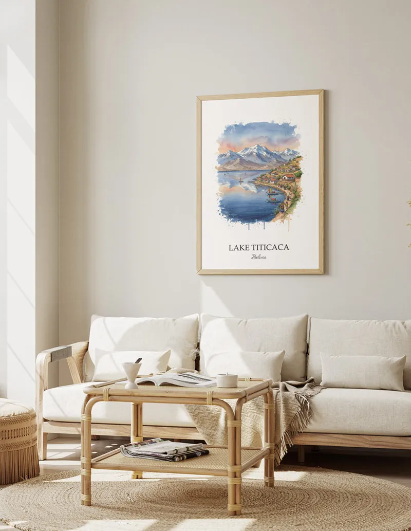 Vintage travel poster of Lake Titicaca, Bolivia in a light frame displayed above a sofa in a bright boho interior.