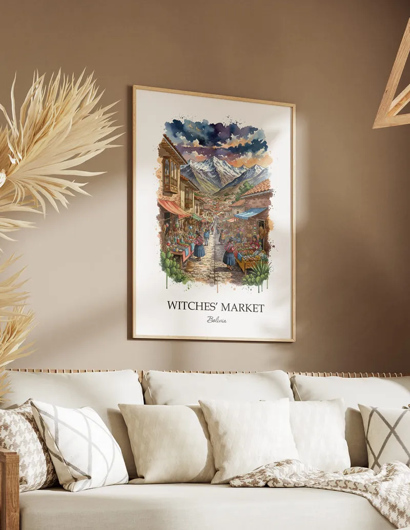 A gorgeous boho-inspired living space with a framed vintage travel poster of Witches' Market in Bolivia on display.