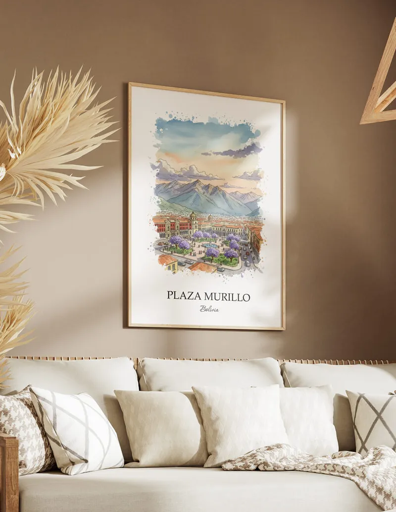 A gorgeous boho-inspired living space with a framed vintage travel poster of Plaza Murillo in Bolivia on display.