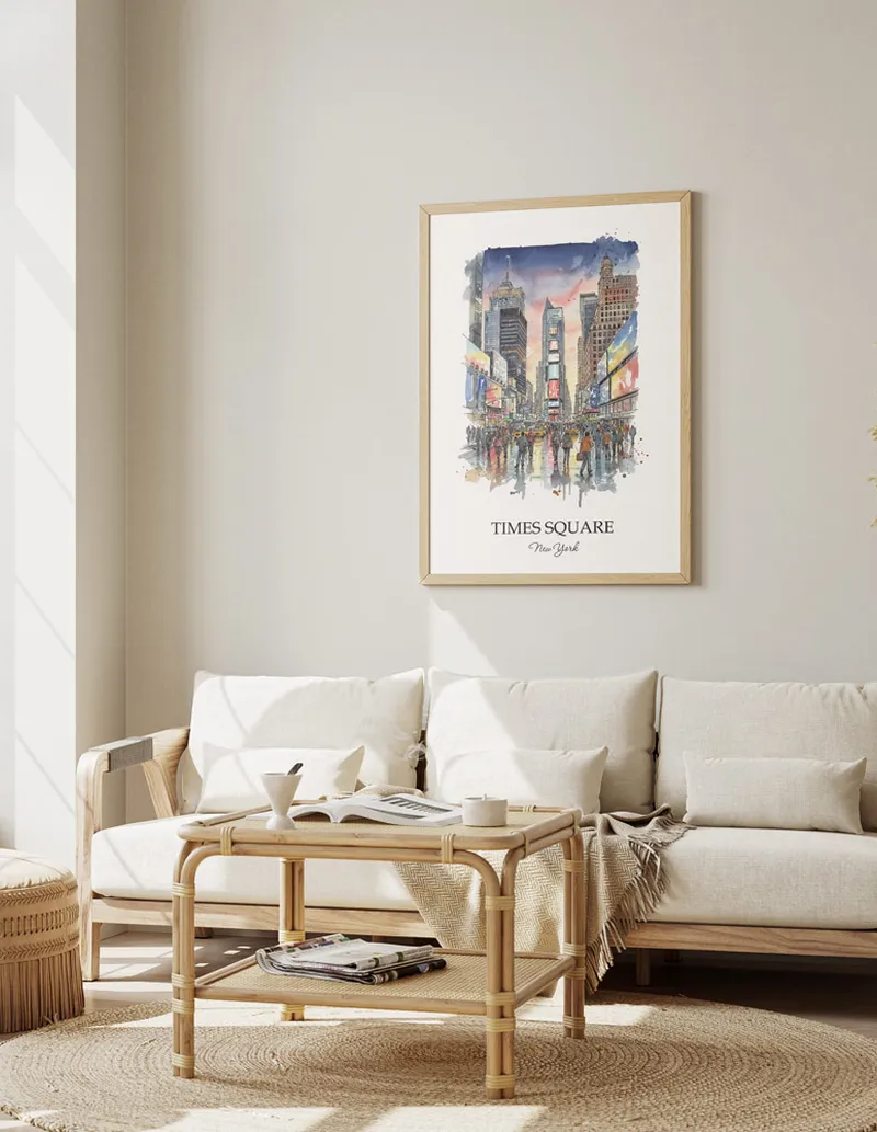 Vintage travel poster of Times Square, New York in a light frame displayed above a sofa in a bright boho interior.