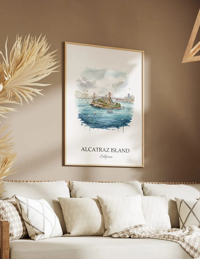 A gorgeous boho-inspired living space with a framed vintage travel poster of Alcatraz Island in California on display.