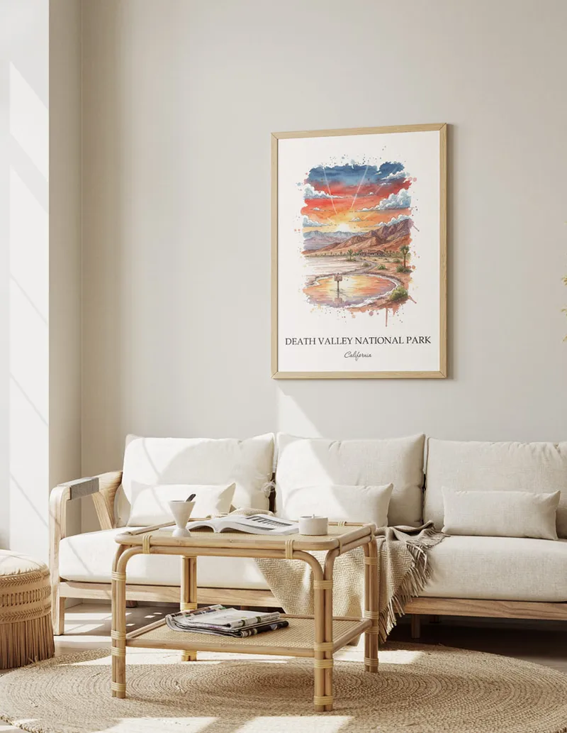 Vintage travel poster of Death Valley National Park, California in a light frame displayed above a sofa in a bright boho interior.