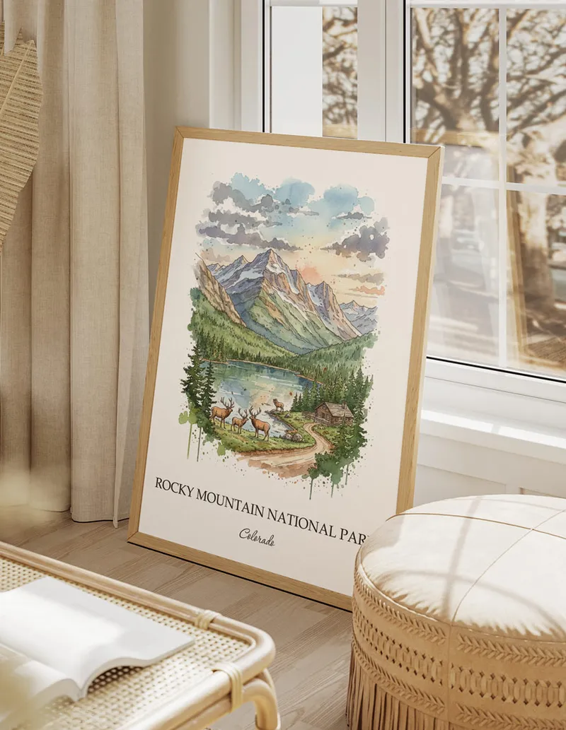 Framed wall art featuring Rocky Mountain National Park, Colorado in a light wood frame hanging above a sofa in a modern living room.