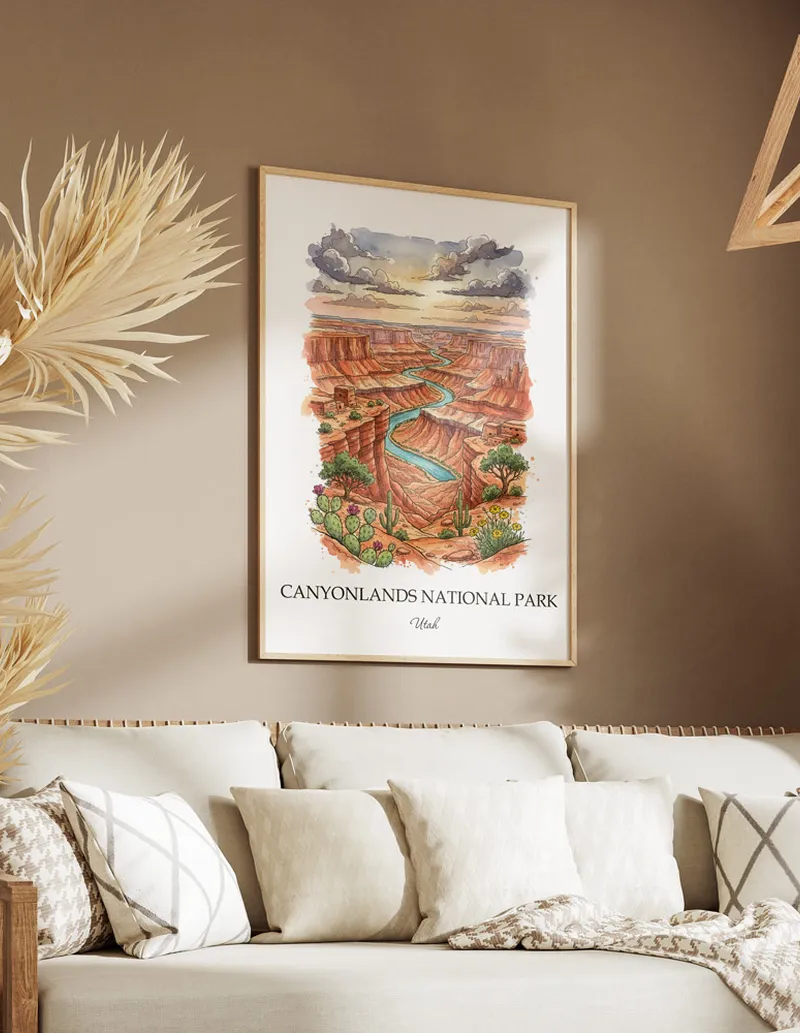 Cozy, well-lit workspace with a minimalist poster of Canyonlands National Park, Utah in a light frame sitting on the desk.