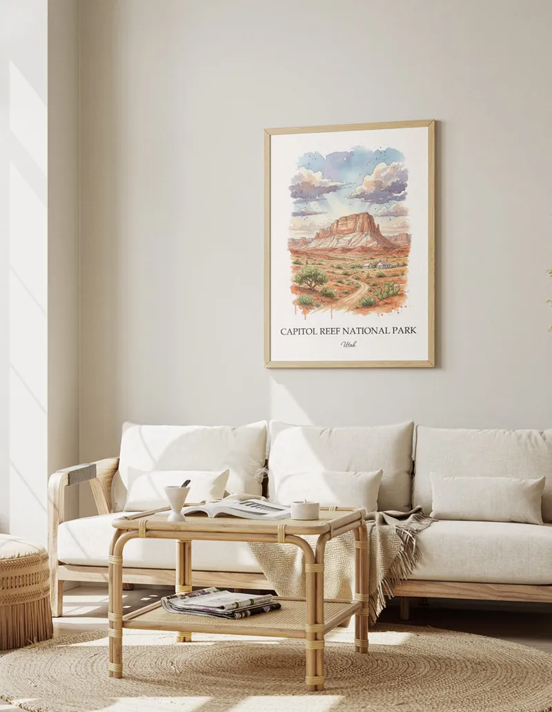 A gorgeous boho-inspired living space with a framed vintage travel poster of Capitol Reef National Park in Utah on display.
